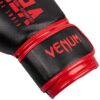 Black/Red Venum Brand boxing glove close up